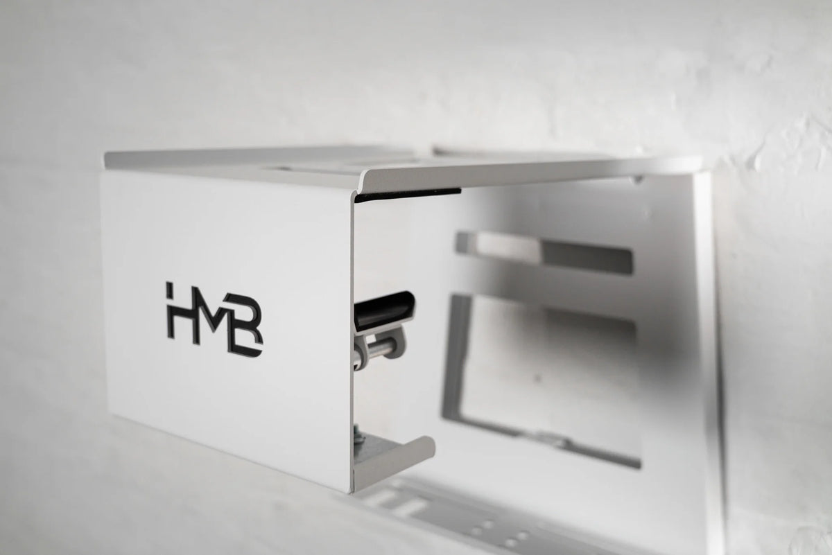Perspective view of the white HMB Ultimate XL wall mount featuring the innovative HMB tilt mechanism, designed to adjust the bike's storage angle for a perfect fit and optimal space efficiency.